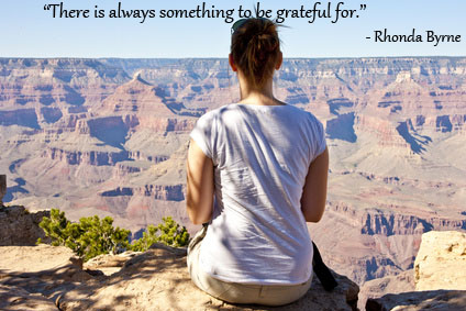 Women viewing the Grand Canyon with Rhonda Byrne quote