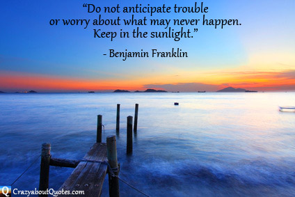 Beautiful sunset over sea with jetty and Benjamin Franklin quote about worry.