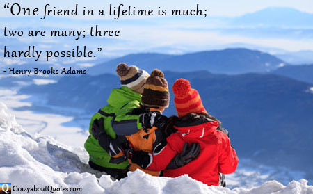 Three friends on snow covered mountain top with friendship quote.