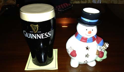 Pint of Guinness and happy snowman.