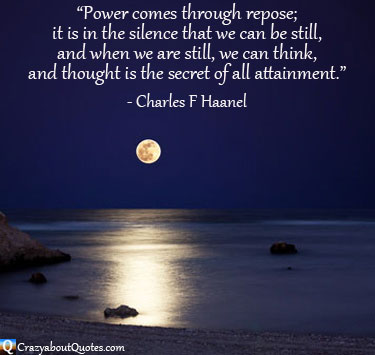 Moonlight shining on shore and rocks with Charles Haanel quote.
