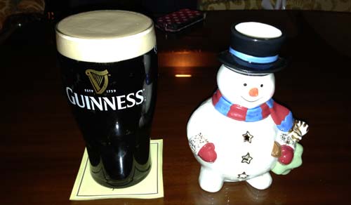 Pint of Guinness and happy snowman. Pint of Guinness and happy snowman.